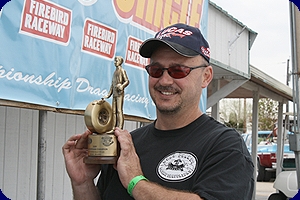 Scott Stephens shows off his Wally after winning Div. 6 at Firebird Raceway